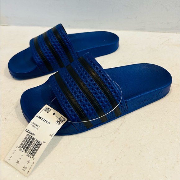 New with tags Adidas Adilette blue and black slides. Size 7 USA women’s - Picture 1 of 8